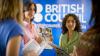 Ladies holding booklets at the British Council