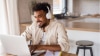 A man studying an English Online course on his laptop